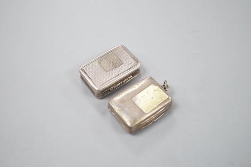 A William IV engraved silver rectangular vinaigrette, with interwoven decoration, TS, Birmingham, 1831, 32mm and a later silver vinaigrette, Birmingham, 1863.